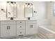 Bathroom featuring dual sinks, a bathtub, and ample lighting at 7006 Lone Eagle Dr # 18, Monroe, NC 28110