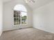 Neutral bedroom featuring a large window, ceiling fan, and carpet flooring at 7006 Lone Eagle Dr # 18, Monroe, NC 28110