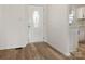 Bright foyer boasts wood-look floors and an elegant front door, leading to the home's living spaces at 7006 Lone Eagle Dr # 18, Monroe, NC 28110