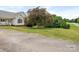 The home boasts a manicured front yard, tree and shrubs at 7006 Lone Eagle Dr # 18, Monroe, NC 28110