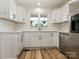 Updated kitchen featuring white cabinetry, stone countertops, and stainless steel appliances at 7006 Lone Eagle Dr # 18, Monroe, NC 28110