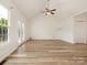Bright open living area features hardwood floors, vaulted ceiling, and access to back yard at 7006 Lone Eagle Dr # 18, Monroe, NC 28110