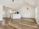 Inviting living space with vaulted ceilings, wood-look floors, and a view into the kitchen at 7006 Lone Eagle Dr # 18, Monroe, NC 28110