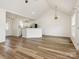 Open-concept living space with wood floors flows seamlessly into the kitchen, creating a bright and airy atmosphere at 7006 Lone Eagle Dr # 18, Monroe, NC 28110
