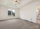Main bedroom boasts neutral carpet, a tray ceiling, and an en suite bathroom at 7006 Lone Eagle Dr # 18, Monroe, NC 28110