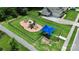 Community playground with slides, climbing structures, and a shaded area offers a fun and safe space at 7011 Hyde Park Dr, Indian Trail, NC 28079