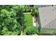 An aerial view of a home with large backyard with mature trees and a brick patio at 7011 Hyde Park Dr, Indian Trail, NC 28079