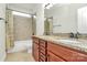 Bathroom featuring double sinks, granite countertops, and a decorative tile backsplash at 7011 Hyde Park Dr, Indian Trail, NC 28079