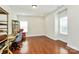 Bright bedroom features hardwood floors, large windows, and ample natural light perfect for a home office at 7011 Hyde Park Dr, Indian Trail, NC 28079