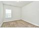 Cozy bedroom with neutral carpet, bright window, and minimalist design providing a clean and inviting space at 7011 Hyde Park Dr, Indian Trail, NC 28079