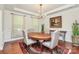 Elegant dining room features hardwood floors, a stylish chandelier, and ample space for entertaining at 7011 Hyde Park Dr, Indian Trail, NC 28079