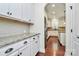 Modern kitchen featuring white cabinets, granite countertops, and stainless steel appliances for a sleek design at 7011 Hyde Park Dr, Indian Trail, NC 28079