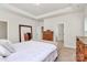 Main bedroom with ensuite and neutral walls and carpet at 7011 Hyde Park Dr, Indian Trail, NC 28079