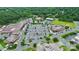 Aerial view of a commercial shopping center with multiple stores, ample parking, and green landscaping at 7011 Hyde Park Dr, Indian Trail, NC 28079