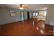 Open living space with hardwood floors seamlessly connects living and dining area at 711 Burtonwood Ln, Lincolnton, NC 28092