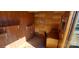 Finished shed interior with wood paneling, desk, and shelving offers potential at 711 Burtonwood Ln, Lincolnton, NC 28092
