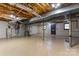 Unfinished basement with exposed ceiling and a water heater at 8007 Caldwell Rd, Harrisburg, NC 28075