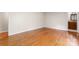Bedroom featuring a hardwood floor and a partial view of the ensuite bathroom at 8007 Caldwell Rd, Harrisburg, NC 28075
