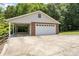 Spacious garage with a carport and ample parking space at 8007 Caldwell Rd, Harrisburg, NC 28075