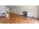 Spacious living room features hardwood floors, fireplace and large window at 8007 Caldwell Rd, Harrisburg, NC 28075