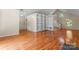 This spacious living room features hardwood floors, built-in bookshelves and lots of natural light at 8007 Caldwell Rd, Harrisburg, NC 28075