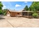 Brick home with a screened in porch and attached garage at 8007 Caldwell Rd, Harrisburg, NC 28075