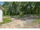 Spacious backyard with a gravel area and ample space for parking, providing convenience and functionality at 848 Ike Lynch Rd, Dallas, NC 28034
