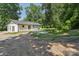 Serene backyard with a quaint patio, perfect for outdoor relaxation and entertaining guests at 848 Ike Lynch Rd, Dallas, NC 28034