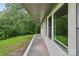 Long, narrow porch with a large windows on a white home with green trim at 848 Ike Lynch Rd, Dallas, NC 28034