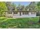 Charming brick home featuring a well-manicured lawn, and a neutral color scheme, perfect for a Gathering at 848 Ike Lynch Rd, Dallas, NC 28034