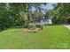 Charming home nestled amongst mature trees, boasting a well-maintained lawn, and classic design at 848 Ike Lynch Rd, Dallas, NC 28034