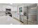 Modern kitchen featuring stainless steel appliances, white cabinets, and light countertops at 848 Ike Lynch Rd, Dallas, NC 28034