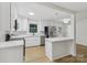 Open concept kitchen boasts stainless steel appliances and a stylish kitchen island at 848 Ike Lynch Rd, Dallas, NC 28034