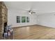 Bright living room with brick fireplace, new floors, and ample natural light at 848 Ike Lynch Rd, Dallas, NC 28034