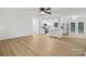 Open-concept space with new floors adjoined to the modernized kitchen at 848 Ike Lynch Rd, Dallas, NC 28034