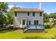 Exterior view of home with blue deck and well-maintained backyard and lawn at 9904 Brigstock Ct, Charlotte, NC 28269