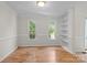 Bright dining room with natural light, hardwood floors, and built-in shelving at 9904 Brigstock Ct, Charlotte, NC 28269