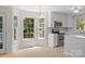 Bright eat-in kitchen with large windows and stainless steel appliances at 9904 Brigstock Ct, Charlotte, NC 28269