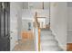 Bright foyer featuring staircase and views into other living spaces at 9904 Brigstock Ct, Charlotte, NC 28269