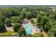 Aerial view of a community pool area, featuring multiple pools and lounge areas at 9904 Brigstock Ct, Charlotte, NC 28269