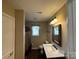 Cozy bathroom featuring tile floors, vanity, and a shower with a curtain at 110 Whitehall Dr, Mooresville, NC 28117