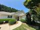 Charming single-story home with a well-manicured lawn and inviting walkway leading to the front entrance at 110 Whitehall Dr, Mooresville, NC 28117