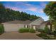 Charming single-story home with a one-car garage, complemented by manicured landscaping and a welcoming entrance at 110 Whitehall Dr, Mooresville, NC 28117