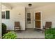 Inviting front porch with seating, showcasing a cozy entrance to the home at 110 Whitehall Dr, Mooresville, NC 28117