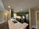 Bright kitchen featuring granite countertops, stainless steel appliances, and green cabinetry at 110 Whitehall Dr, Mooresville, NC 28117