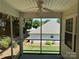 Relaxing screened-in porch overlooking the backyard with mature trees at 110 Whitehall Dr, Mooresville, NC 28117