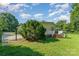 Backyard featuring home, deck, gated driveway and gate at 1107 Fairfield Dr, Gastonia, NC 28054