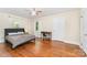 Bedroom featuring a ceiling fan, hardwood floors, and bright windows at 1107 Fairfield Dr, Gastonia, NC 28054