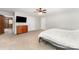 Spacious bedroom with a ceiling fan, carpet flooring, closet, and wood dresser at 1107 Fairfield Dr, Gastonia, NC 28054