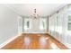 Bright dining room with hardwood floors, natural light, and a chandelier at 1107 Fairfield Dr, Gastonia, NC 28054